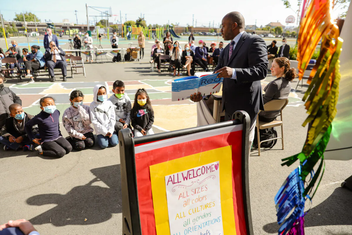 Superintendent of Schools Tony Thurmond reads from the book "Red: A Crayon's Story" to second-grade students at Nystrom Elementary School in Richmond, Calif., on May 17, 2022. (Justin Sullivan/Getty Images)
