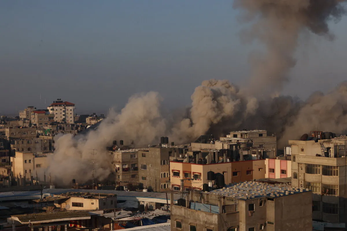 Smoke billows in Rafah on the southern Gaza Strip city after the end of a seven-day ceasefire, on Dec. 1, 2023. (Said Khatib/ AFP via Getty Images)