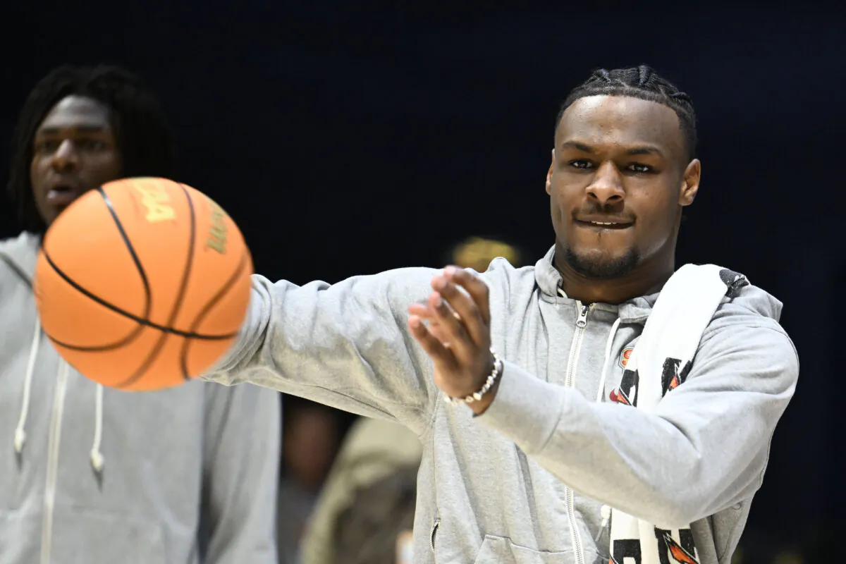 Southern California guard Bronny James joins teammates on the court during warmups for an NCAA college basketball game against Seton Hall in San Diego on Nov. 23, 2023. (Denis Poroy/AP Photo)