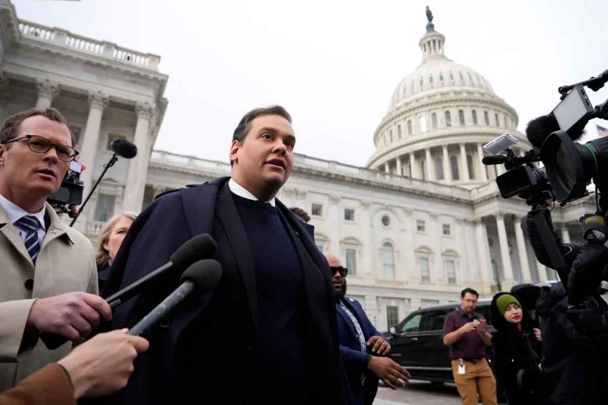 Rep. George Santos (R-NY) is surrounded by journalists as he leaves the U.S. Capitol after his fellow members of Congress voted to expel him from the House of Representatives on Dec. 1, 2023 in Washington. (Drew Angerer/Getty Images)