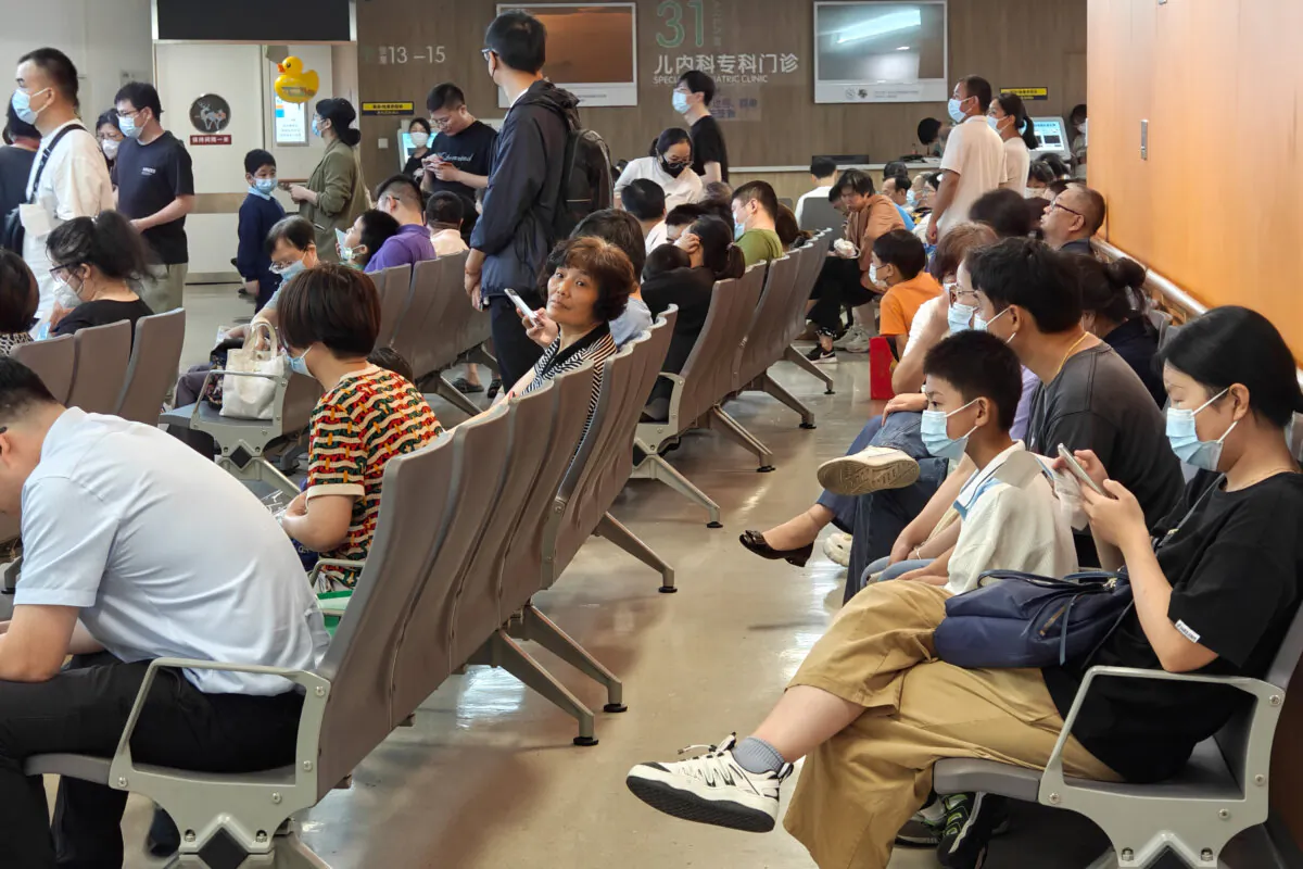 Patients line up for an emergency pre-check at the new pediatric building of Xinhua Hospital in Shanghai, China, on the night of Sept. 25, 2023. (CFOTO/ file/Future Publishing via Getty Images)