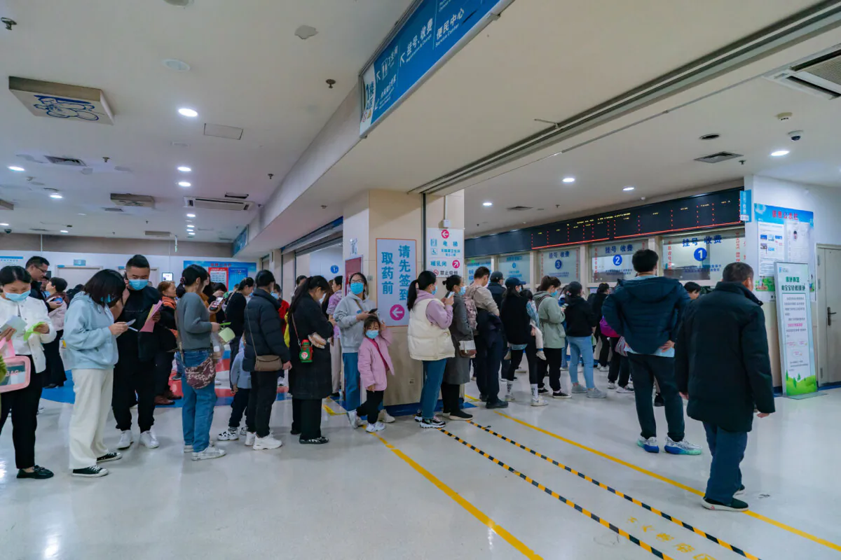 Parents with children suffering from respiratory diseases line up at a children's hospital in Chongqing, China, on Nov. 23, 2023. (CFOTO/Future Publishing via Getty Images)