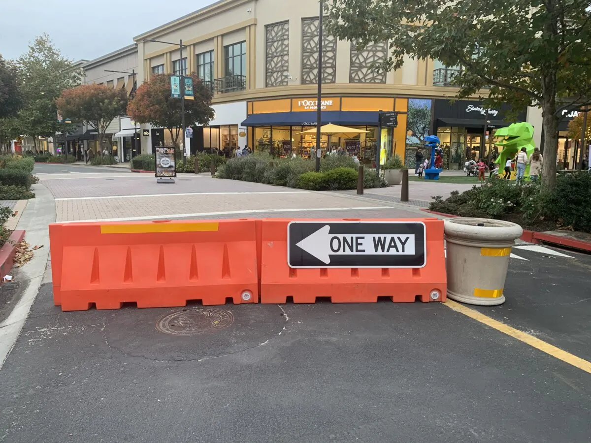 Traffic barricades block the road through Broadway Plaza in Walnut Creek, Calif., on Nov. 22, 2023. (Helen Billings/The Epoch Times)