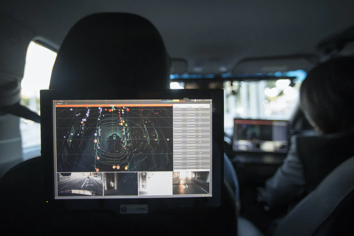 Data from LiDAR, radar, cameras, and GPS units are seen inside a car equipped with using PolySync autonomy system development for creating and deploying driverless vehicles being demonstrated during the four-day auto trade show AutoMobility LA at the Los Angeles Convention Center in Los Angeles on Nov. 17, 2016. (David McNew/Getty Images)