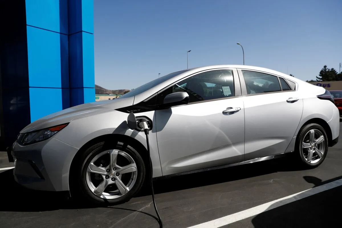 A Chevrolet Volt plug-in hybrid vehicle is being charged at Stewart Chevrolet in Colma, Calif., on Oct. 3, 2017. (Stephen Lam/Reuters)