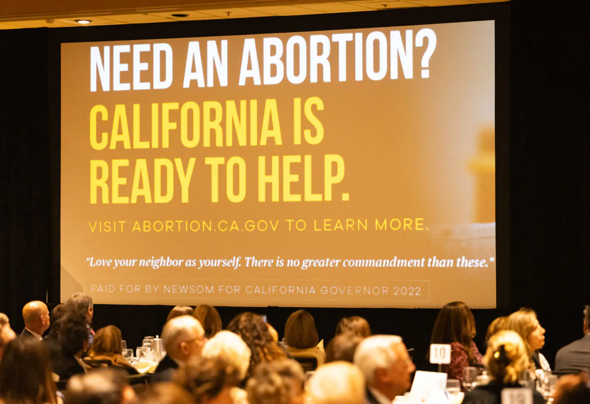 An abortion ad sponsored by California Governor Gavin Newsom sits on display in Costa Mesa, Calif., on Nov. 30 2023. (John Fredricks/The Epoch Times)