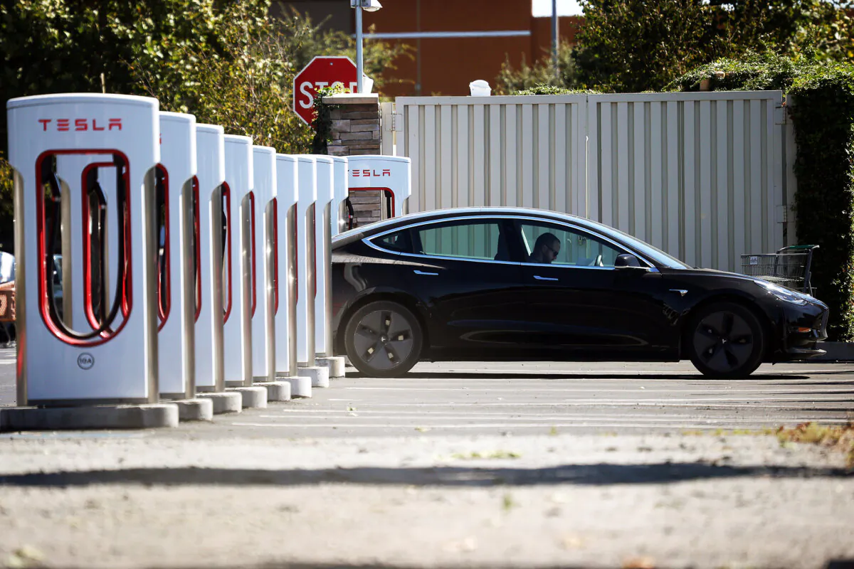 A Tesla sits parked at a Tesla Supercharger in Petaluma, Calif., on Sept. 23, 2020. (Justin Sullivan/Getty Images)