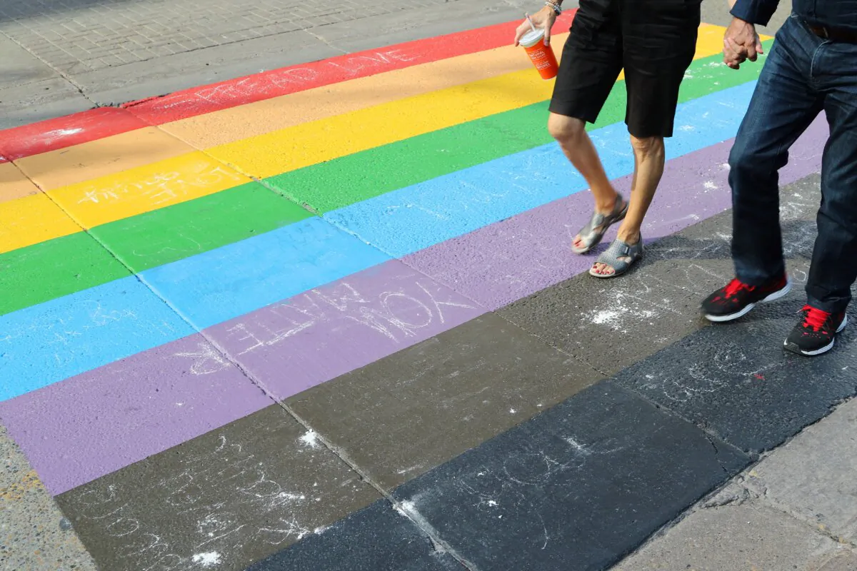 People walk on a rainbow crosswalk in a file photo. (The Canadian Press/Dave Chidley)