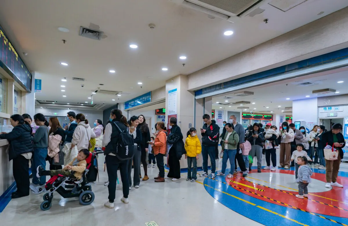 Parents with children suffering from respiratory diseases line up at a children's hospital in Chongqing, China, on Nov. 23, 2023. (CFOTO/Future Publishing via Getty Images)
