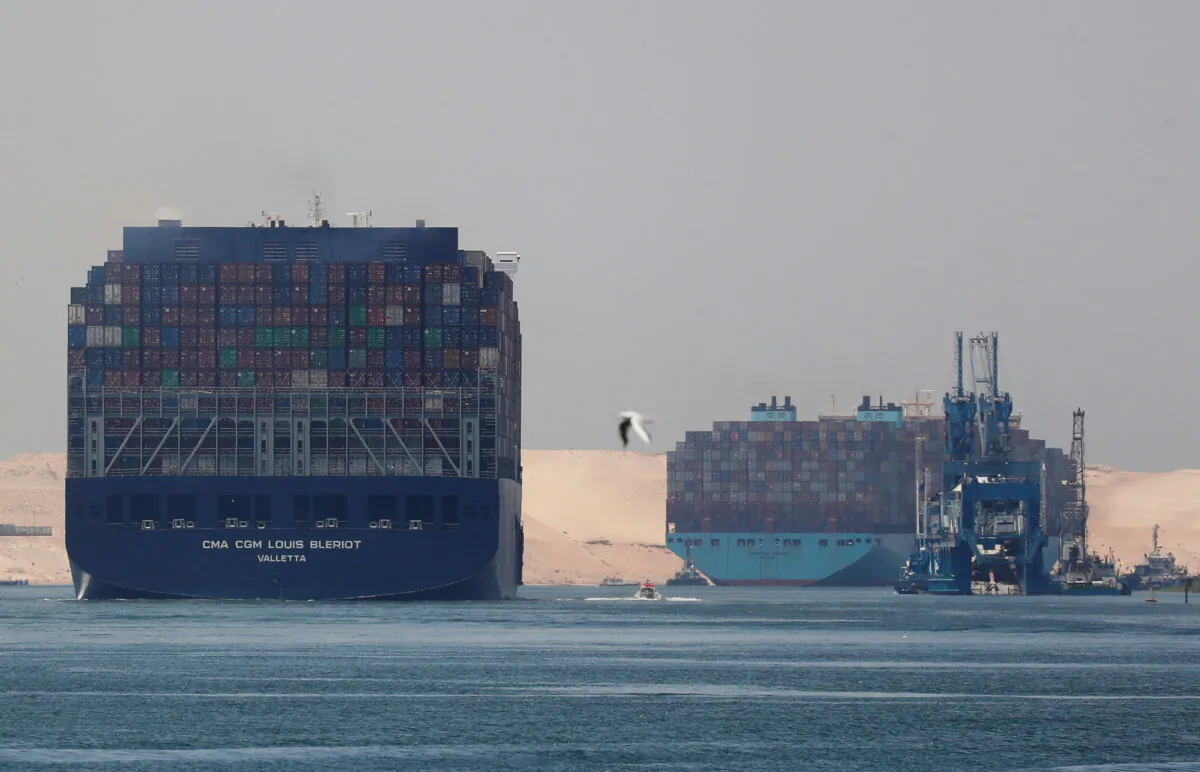 CMA CGM Louis Bleriot and a Maersk Line container ship pass through the Suez Canal in Ismailia, Egypt, on July 7, 2021. (Amr Abdallah Dalsh/Reuters)