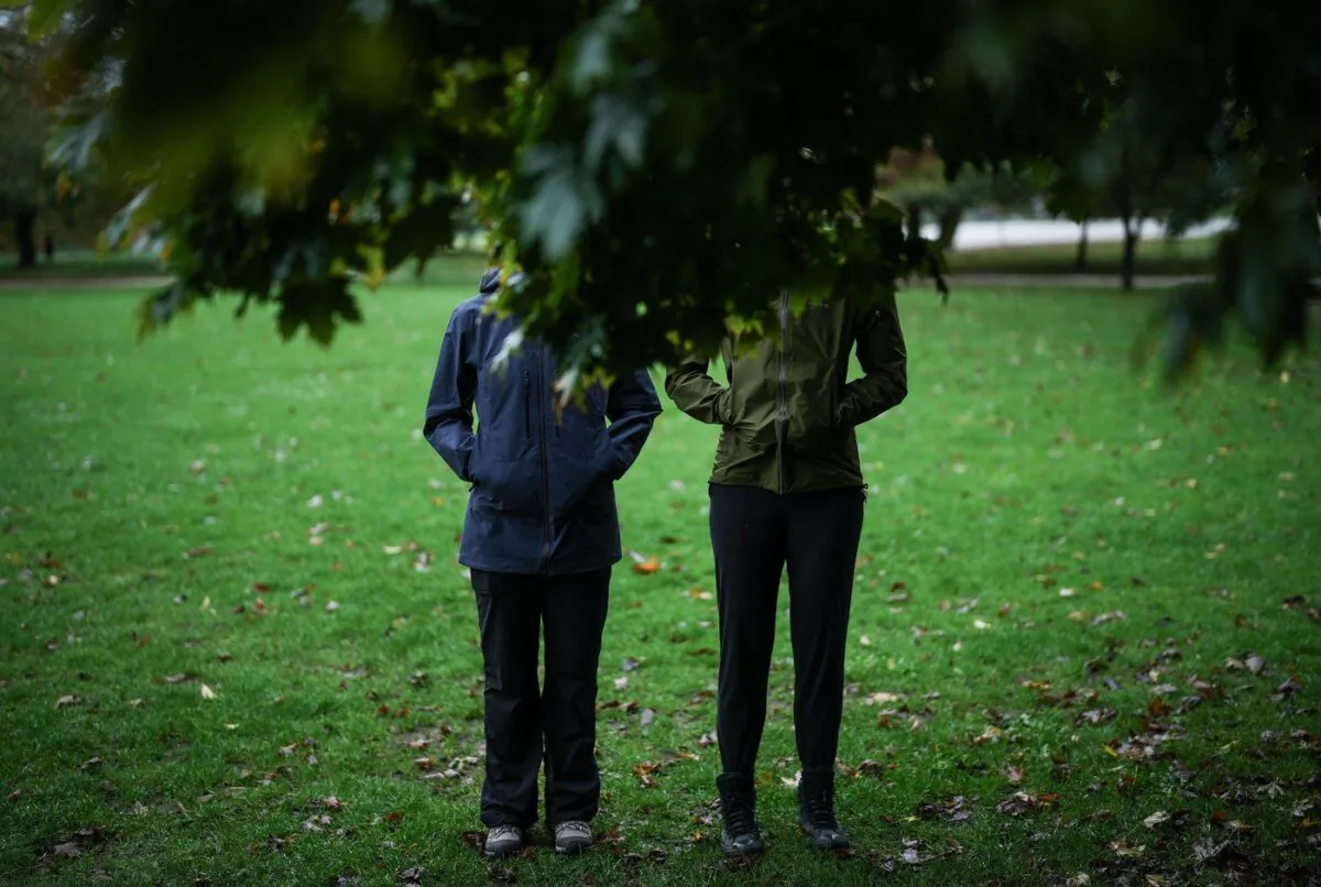 Two Canadian Security Intelligence Service surveillance officers pose for a photograph in Vancouver on Oct. 18, 2023. (The Canadian Press/Darryl Dyck)