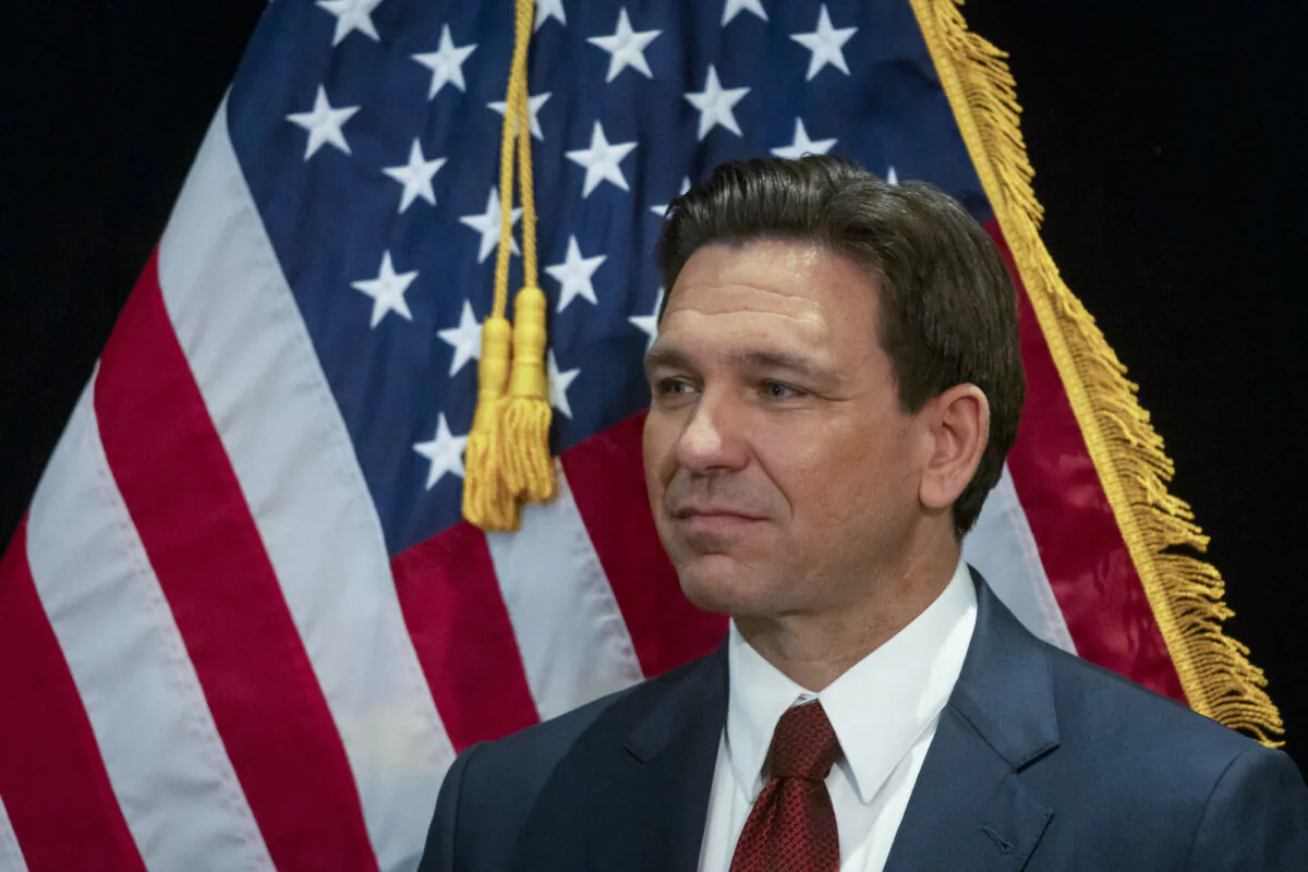 Florida governor and Republican presidential hopeful Ron DeSantis speaks in the spin room following a debate held by Fox News, in Alpharetta, Ga., on Nov. 30, 2023. (Christian Monterrosa/AFP via Getty Images)
