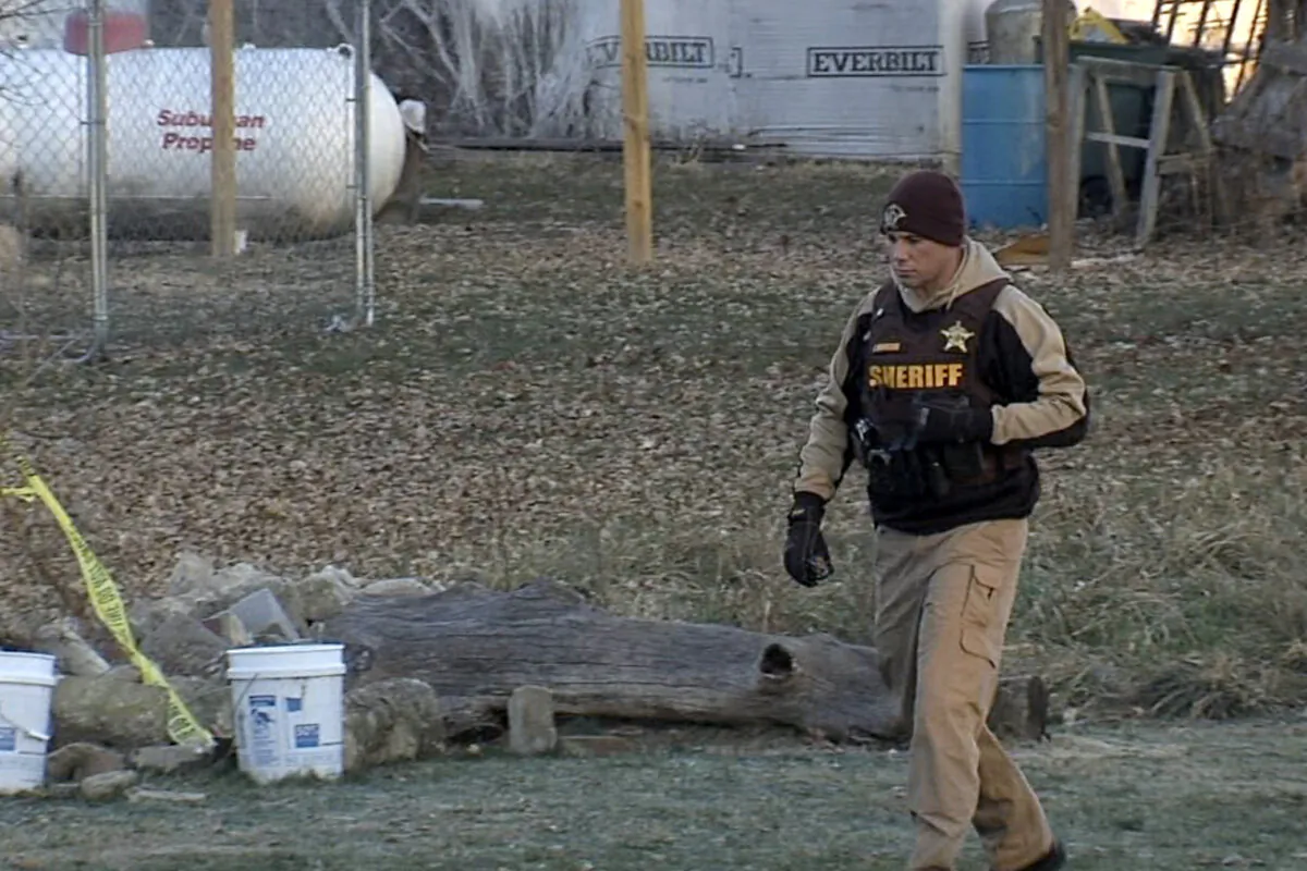 A sheriff's official walks near the location where Valerie Tindall's remains were discovered, in Arlington, Ind., on Nov. 29, 2023, in a still from video. (WRTV via AP)