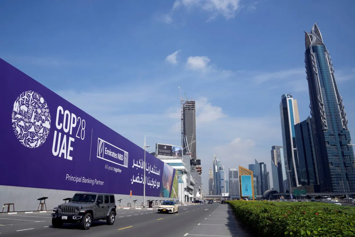 A billboard advertising COP28 in Dubai, United Arab Emirates, on Nov. 27, 2023. Representatives are gathering in the city for the 28th Conference of the Partners summit, which runs from Nov. 30 to Dec. 12, 2023. (AP Photo/Kamran Jebreili) 