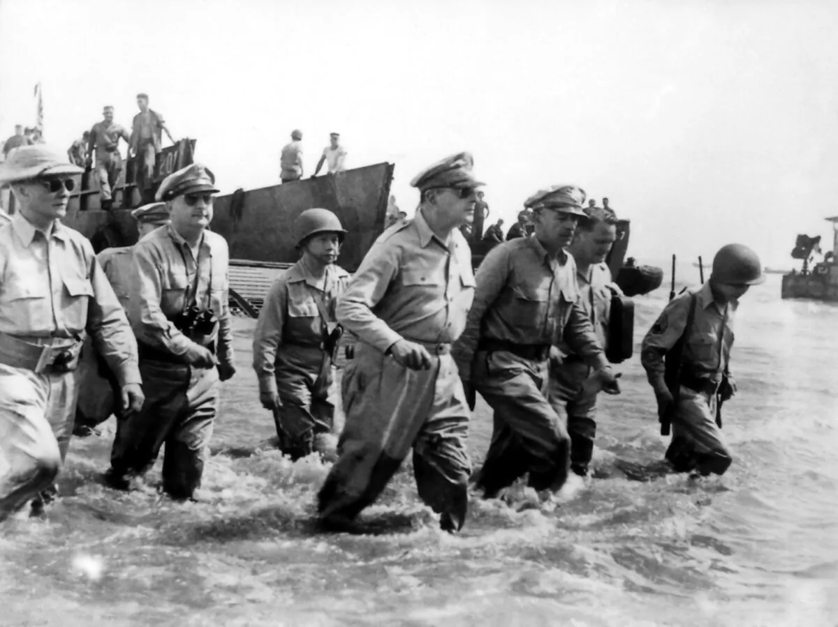 Gen. Douglas MacArthur wades ashore during initial landings at Leyte Gulf in the Philippines. (Public Domain)