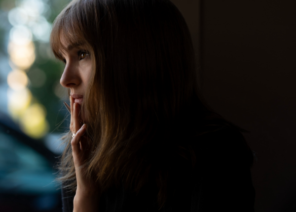 woman staring out window in MAY DECEMBER
