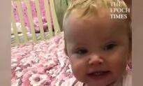 Baby Tries to Put Pacifier in Dad’s Mouth