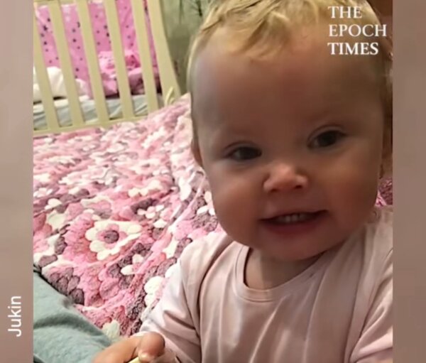 Baby Tries to Put Pacifier in Dad’s Mouth