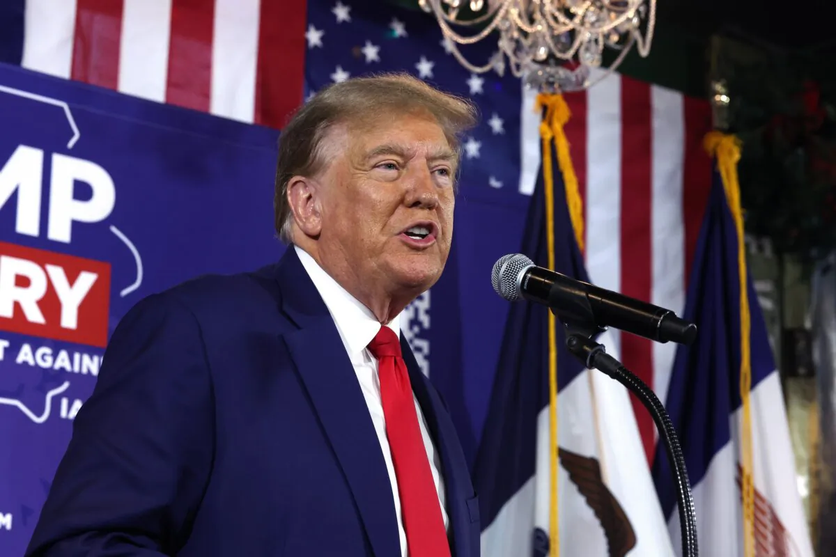 Republican presidential candidate former President Donald Trump speaks at a commit to caucus campaign event at the Whiskey River bar in Ankeny, Iowa, on Dec. 2, 2023. (Scott Olson/Getty Images)