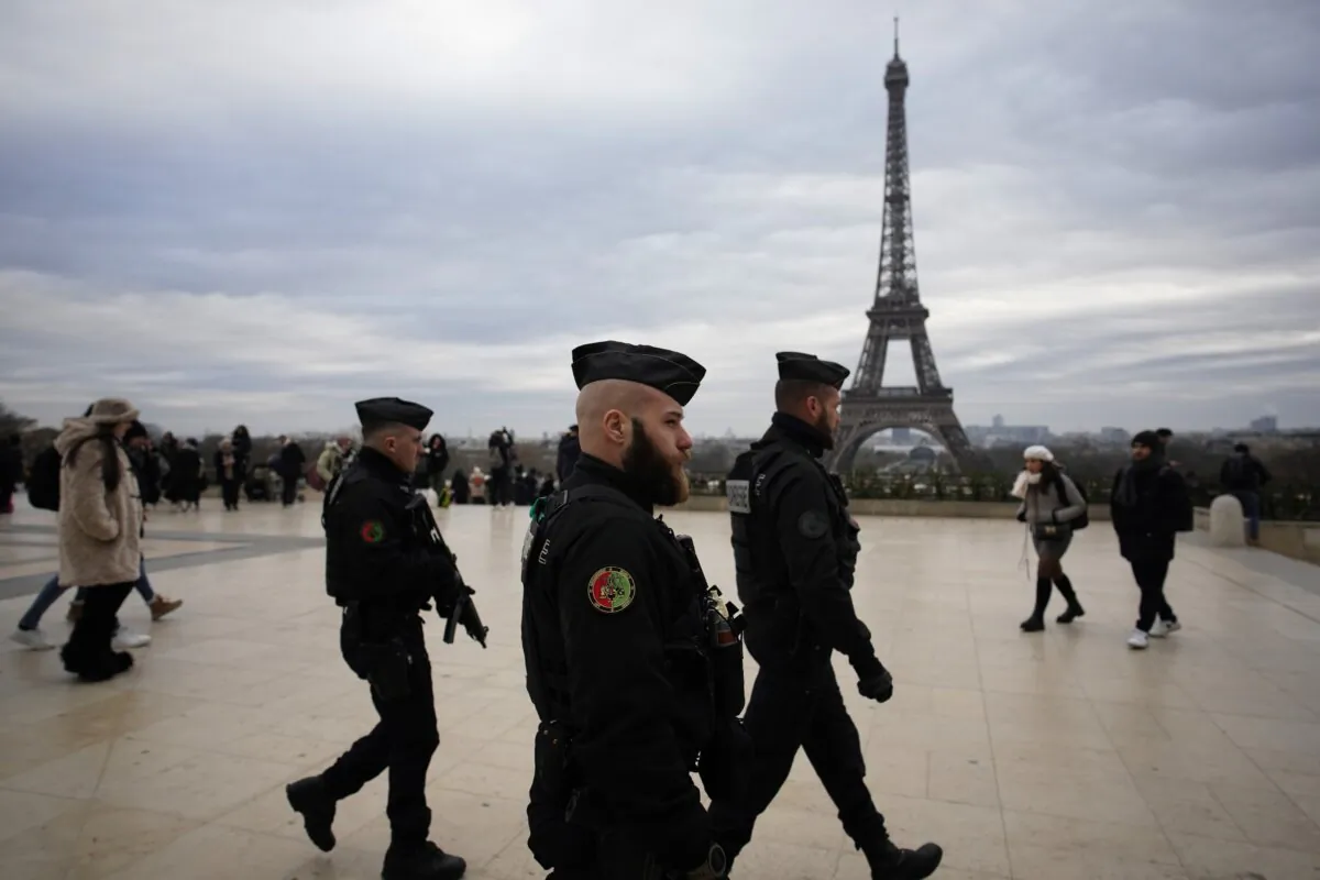 French gendarmes patrol the Trocadero plaza near the Eiffel Tower after a man targeted passersbys late saturday, killing a German tourist with a knife and injuring two others in Paris on Dec. 3, 2023. (Christophe Ena/AP Photo)