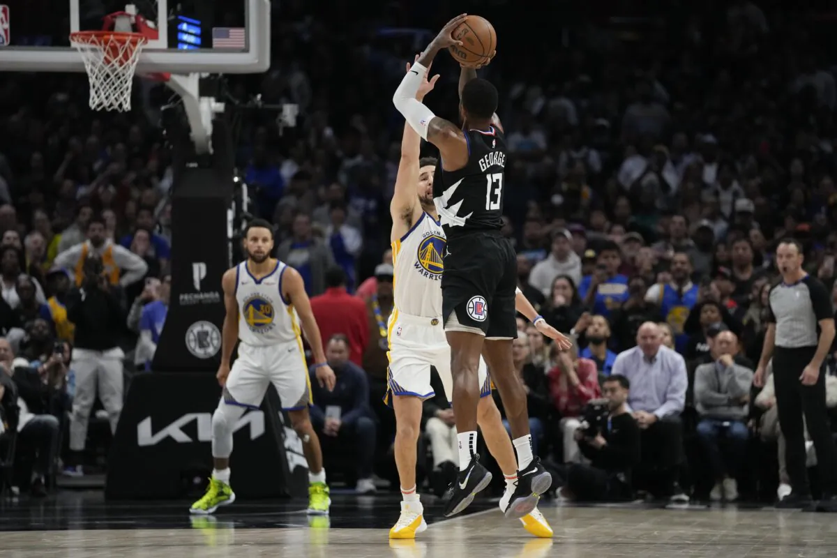 Los Angeles Clippers forward Paul George (13) shoots a 3-pointer against Golden State Warriors guard Klay Thompson during the second half of an NBA basketball game in Los Angeles on Dec. 2, 2023. (Ashley Landis/AP Photo)