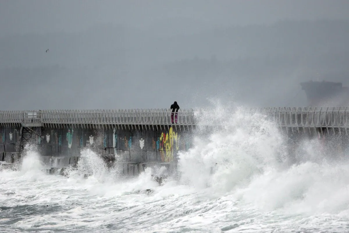 Waves pound Ogden Point breakwater during the first major storm of the year in Victoria, on Jan. 5, 2021. (The Canadian Press/Chad Hipolito)