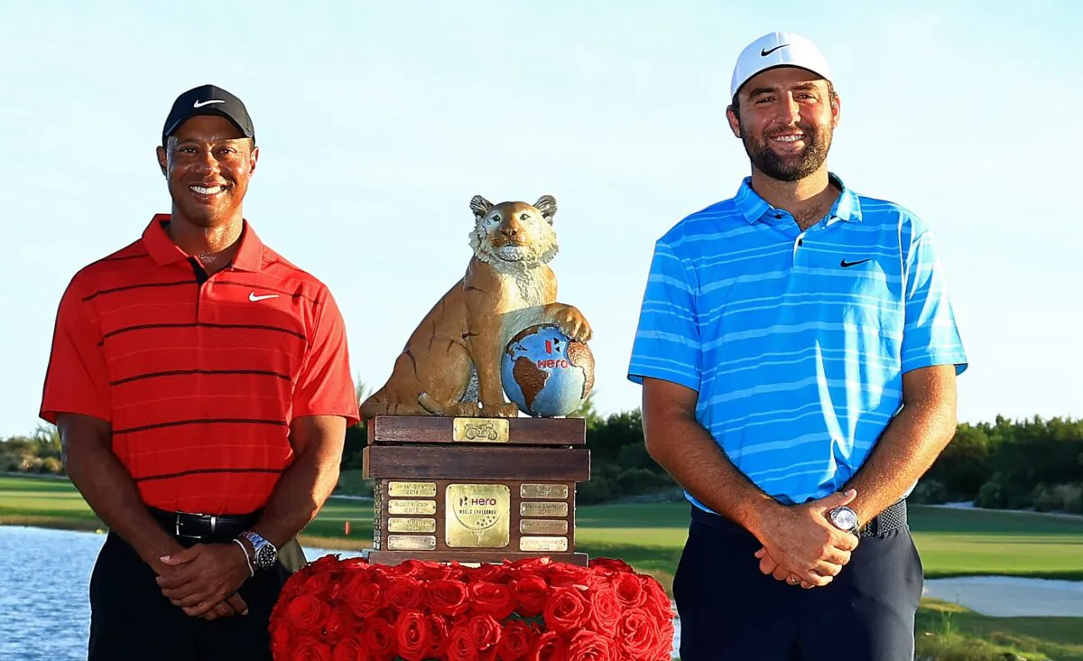 Scottie Scheffler of the United States and tournament host Tiger Woods pose with the trophy after winning the final round of the Hero World Challenge in Nassau, Bahamas, on Dec. 3, 2023. (Mike Ehrmann/Getty Images,)