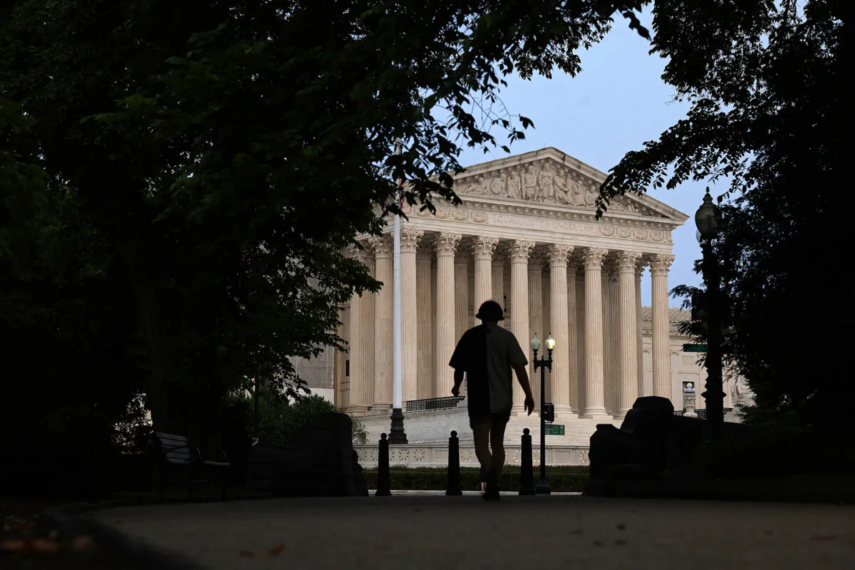 A pedestrian walks toward the U.S. Supreme Court in Washington on June 5, 2023. (Alex Wong/Getty Images