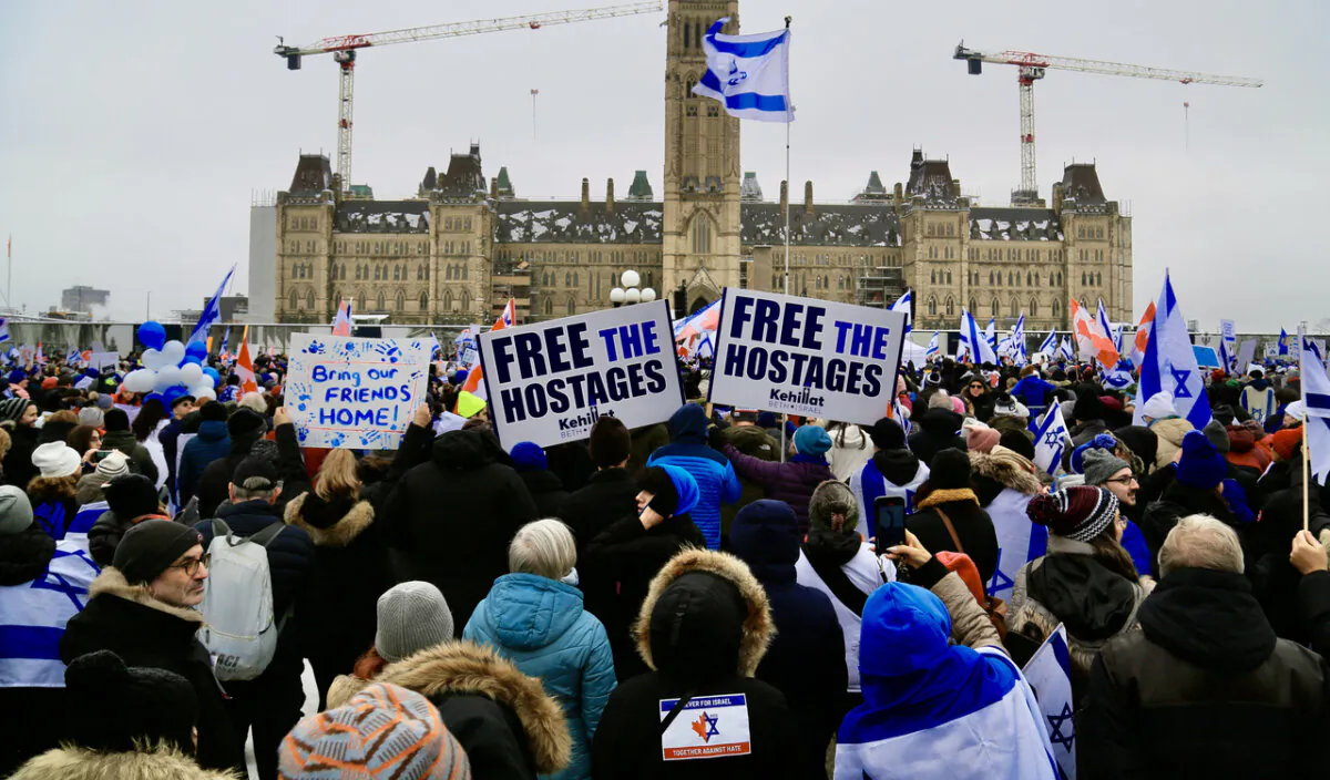 A rally in support of the hostages taken by Hamas as well as the Jewish community in Israel and Canada was held on Parliament Hill in Ottawa on Dec. 4, 2023. Participants were seen holding signs that read "Free the Hostages." (Jonathan Ren/The Epoch Times)