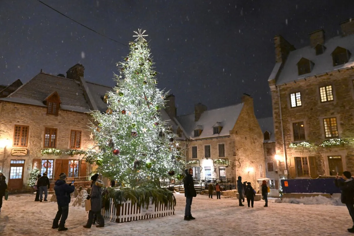 A Christmas tree and decorations are seen in the old historic Place Royale in Quebec City on Dec. 21, 2022. (The Canadian Press/Jacques Boissinot)