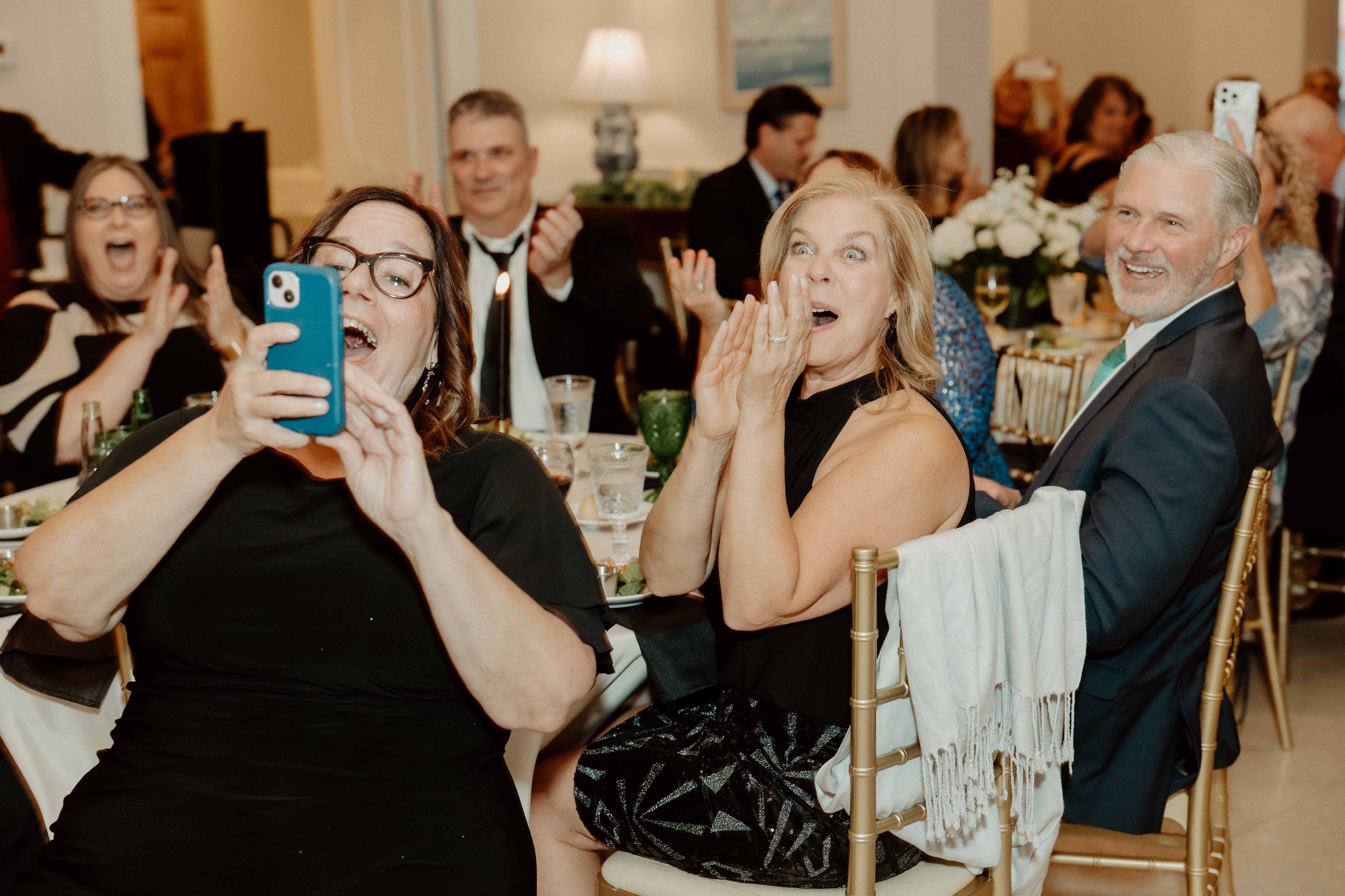 Wedding guests are surprised on seeing Mrs. Ross.