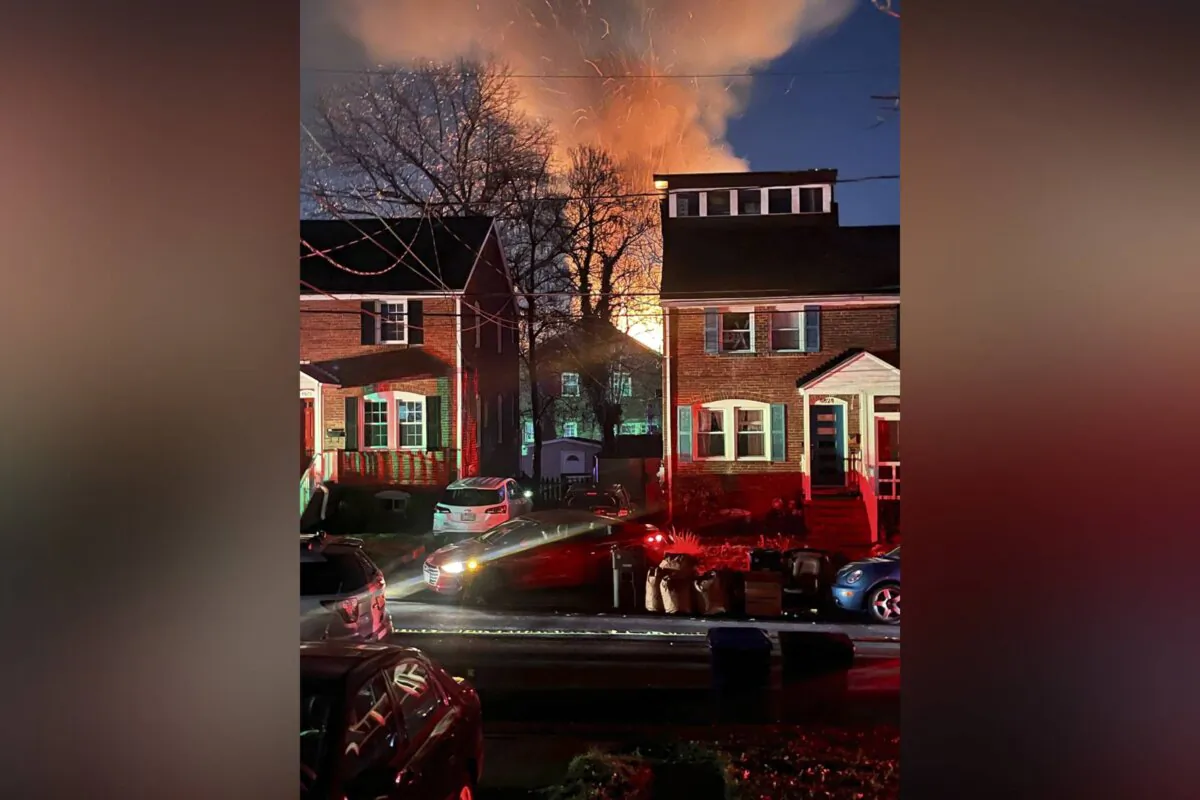 A home is seen exploding from a distance in Arlington, Va., on Dec. 4, 2023. (AP Photo)