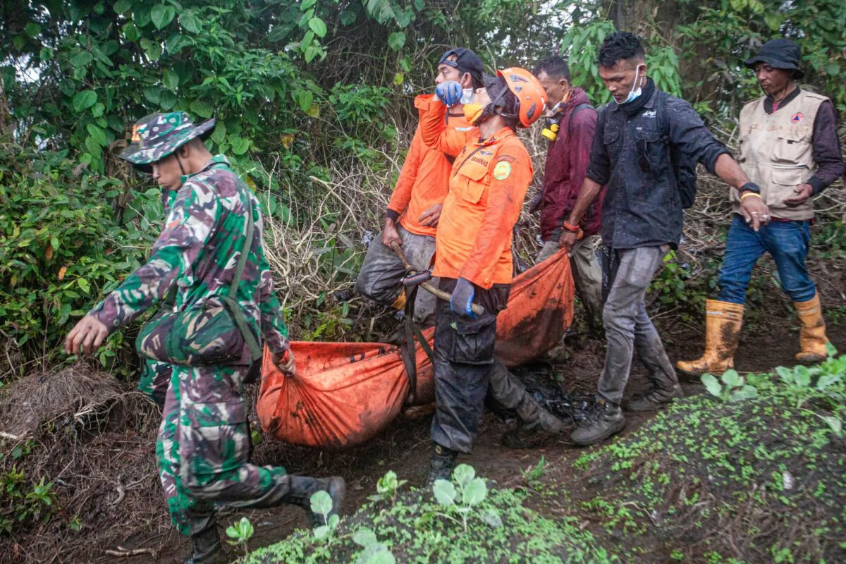 Rescuers evacuate one of the victims who died on Mount Marapi when it erupted on December 3, in Agam, West Sumatra Province, on Dec. 5, 2023. (Adi Prima/AFP via Getty Images)