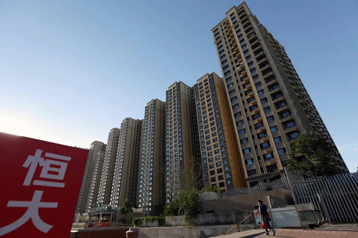 An Evergrande sign near residential buildings at an Evergrande residential complex in Beijing on Sept. 27, 2023. (Florence Lo/Reuters)