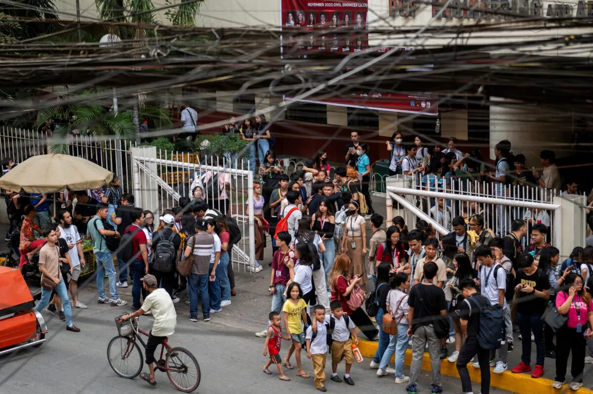 Students evacuate following an earthquake, in Manila, Philippines, on Dec. 5, 2023. (Lisa Marie David/Reuters)