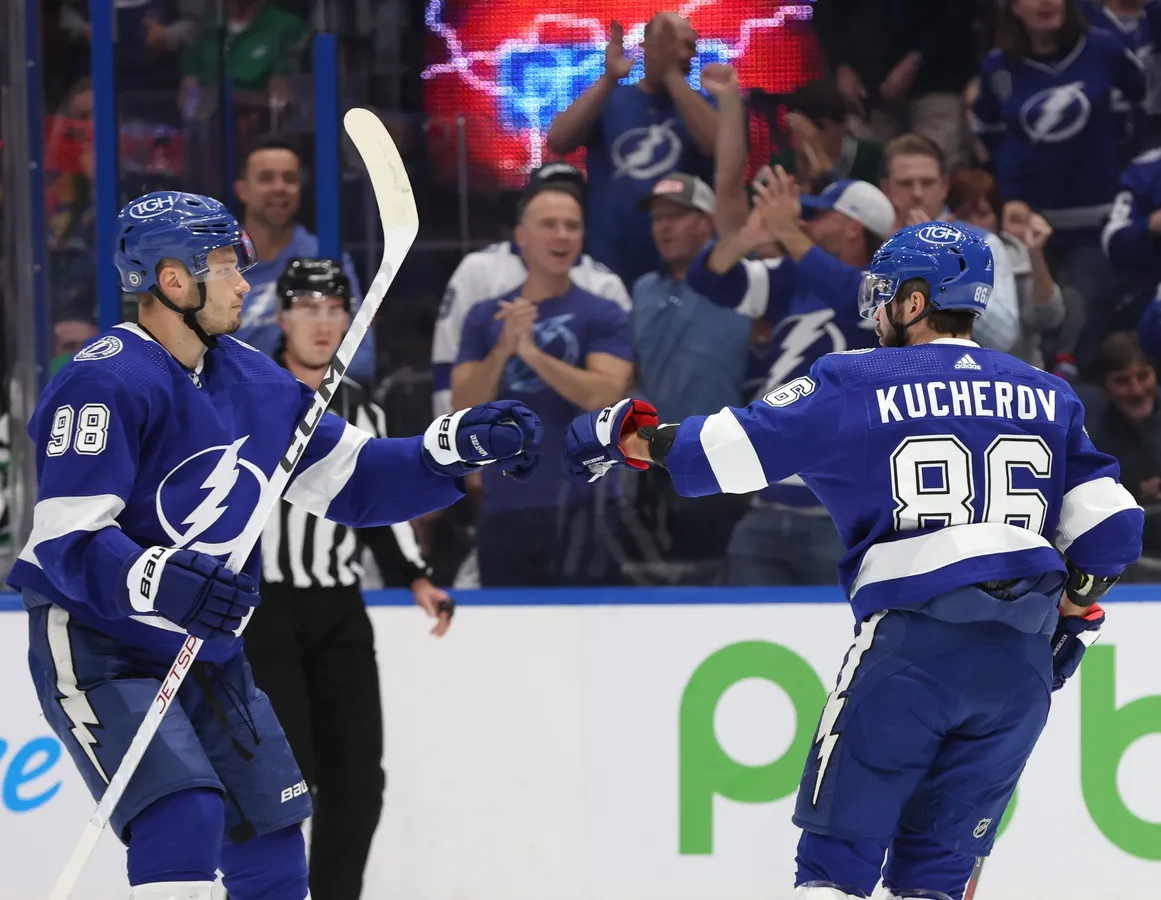 Tampa Bay Lightning right wing Nikita Kucherov (86) celebrates with defenseman Mikhail Sergachev (98) after he scores a goal against the Dallas Stars during the first period at Amalie Arena in Tampa, Fla., on Dec. 4, 2023. (Kim Klement Neitzel-USA TODAY Sports via Field Level Media)