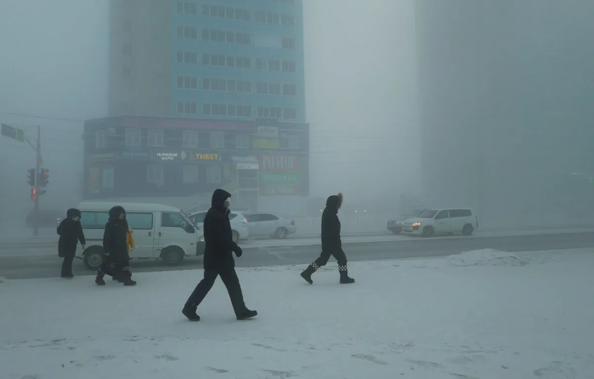 Pedestrians walk along a street on a frosty day in Yakutsk, Russia, on Dec. 5, 2023. (Roman Kutukov/Reuters)