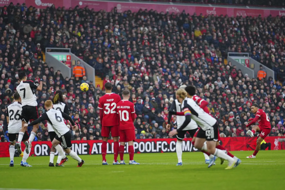 Liverpool's Trent Alexander-Arnold (R) takes a free kick during the English Premier League soccer match between Liverpool and Fulham at the Anfield stadium in Liverpool on Dec. 3, 2023. (Jon Super/AP Photo)
