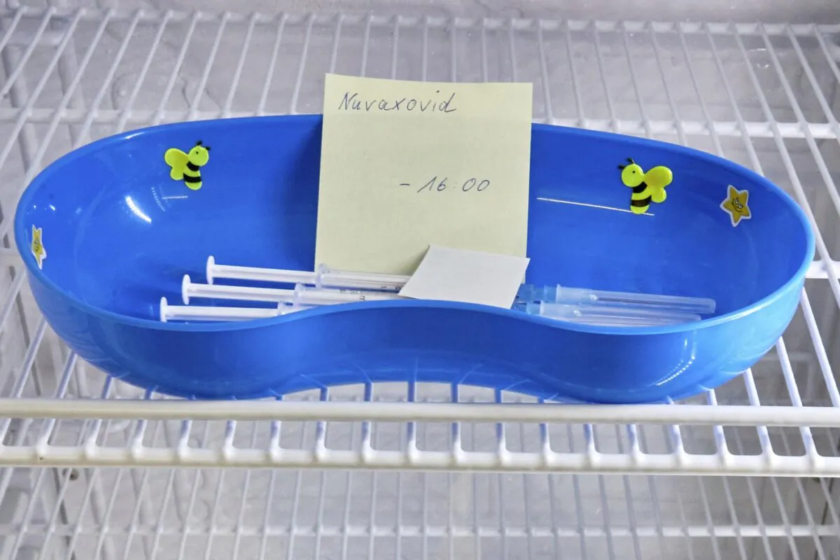 A kidney dish with syringes containing the Novavax COVID-19 vaccine sits in a refrigerator ready for use at a vaccination center in Prisdorf, Germany, on Feb. 26, 2022. (The Canadian Press/Georg Wendt)