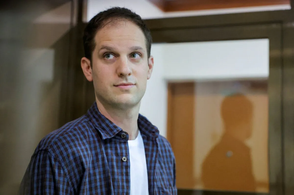 Wall Street Journal reporter Evan Gershkovich stands inside an enclosure for defendants before a court hearing to consider an appeal against his pre-trial detention on espionage charges in Moscow on Oct. 10, 2023. (Evgenia Novozhenina/Reuters)