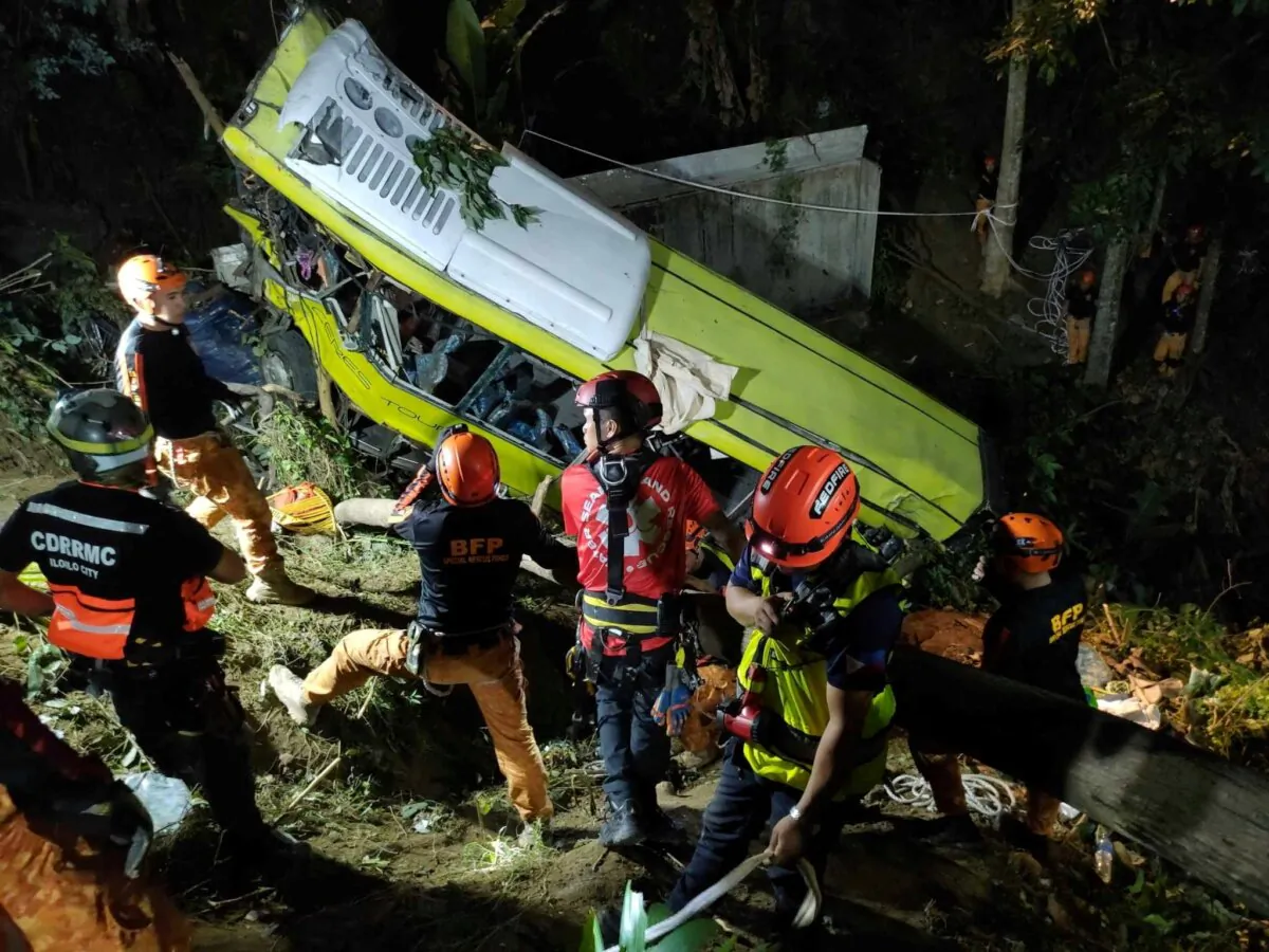 Rescuers conduct a retrieval operation after a bus carrying dozens of people lost its brakes and fell off a cliff in the central province of Antique, Philippines, on Dec. 5, 2023. (Iloilo City Disaster Risk Reduction and Management Office - Urban Search and Rescue Unit/ Reuters)