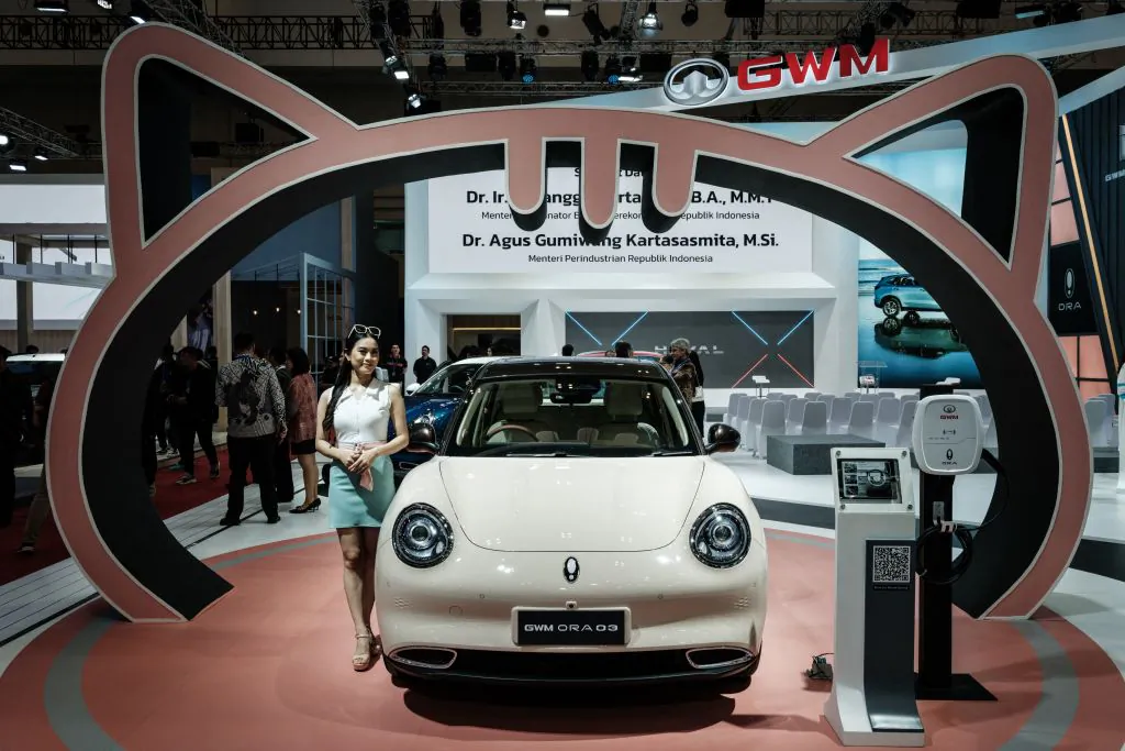 Chinese automobile manifactuare Great Wall Motor (GWM) displays the new compact electric vehicle "ORA Good Cat 03" during the 30th Gaikindo Indonesia International Auto Show (GIIAS) at the Indonesia Convention Exhibition (ICE) in Tangerang on Aug. 10, 2023. (Yasuyoshi Chiba/AFP via Getty Images)