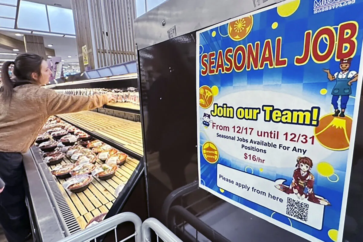 A hiring sign is displayed at a grocery store in Arlington Heights, Ill., on Dec. 4, 2023. (Nam Y. Huh/AP Photo)