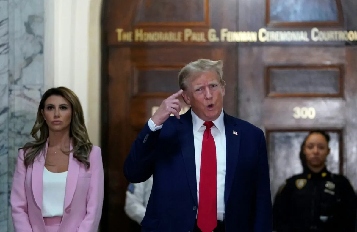 Former US President Donald Trump (C) speaks to members of the media as he arrives at the New York State Supreme Court during the civil fraud trial against the Trump Organization, in New York City on Dec. 7, 2023. (Timothy A. Clary/AFP via Getty Images)