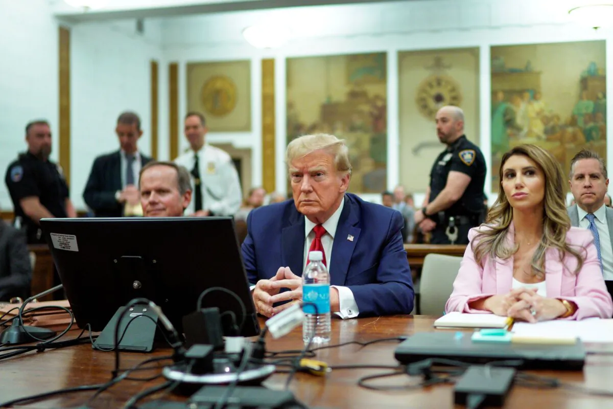 Former U.S. President Donald Trump sits at the defense table with his attorneys Christopher Kise (L) and Alina Habba (R) in New York State Supreme Court on December 7, 2023 in New York City. (Photo by Eduardo Munoz Alvarez-Pool/Getty Images)