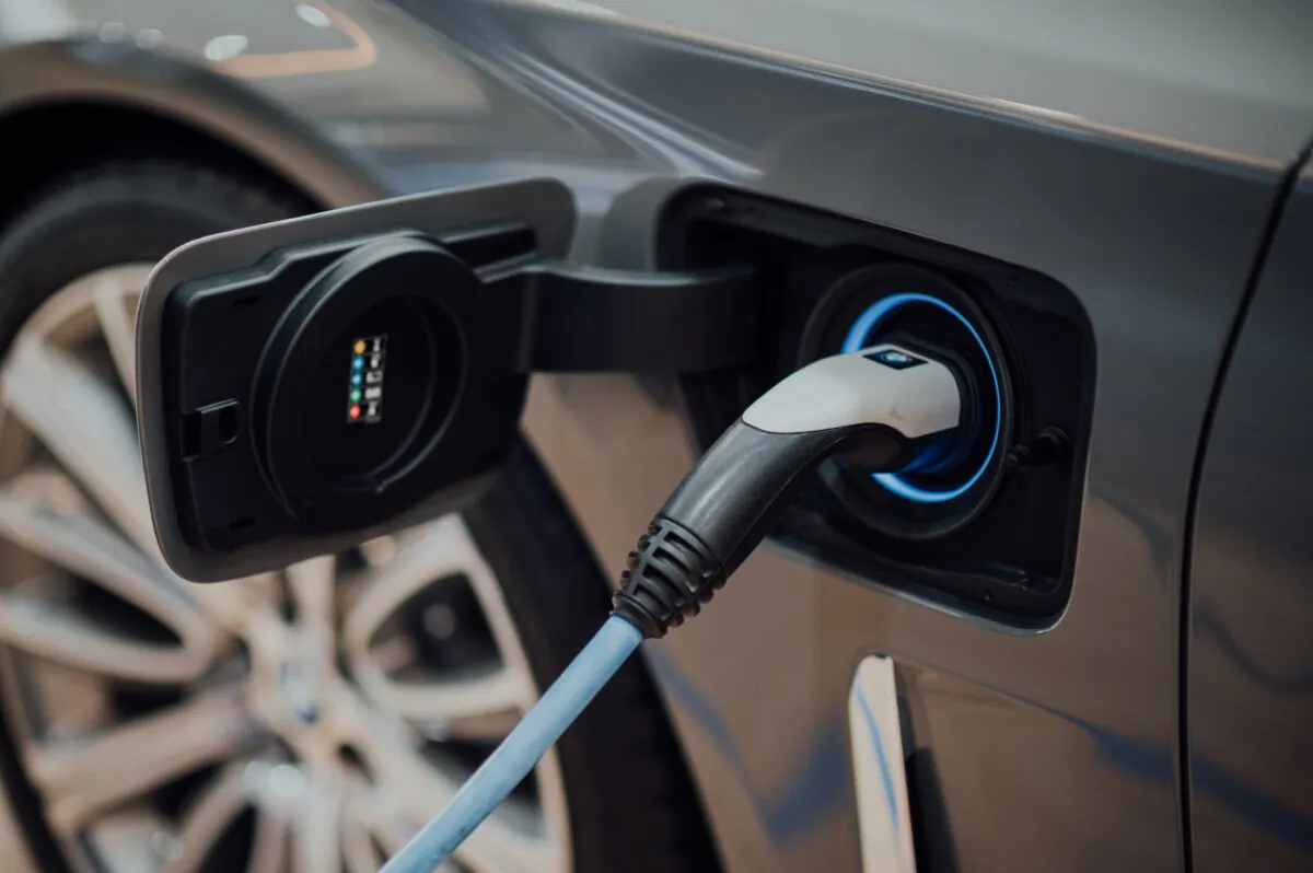 An electric vehicle being charged is seen in a file photo. (CHUTTERSNAP/Unsplash.com)