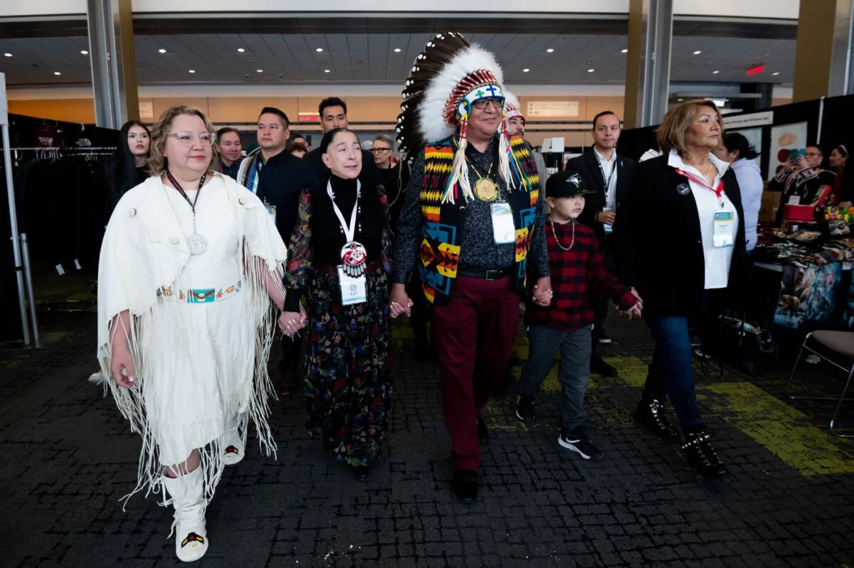 Cindy Woodhouse (L), interim national chief Joanna Bernard (2nd L) and David Pratt (C) walk towards the main stage during the third day of the Assembly of First Nations Special Chiefs Assembly in Ottawa, on Dec. 7. 2023. (The Canadian Press/Spencer Colby)