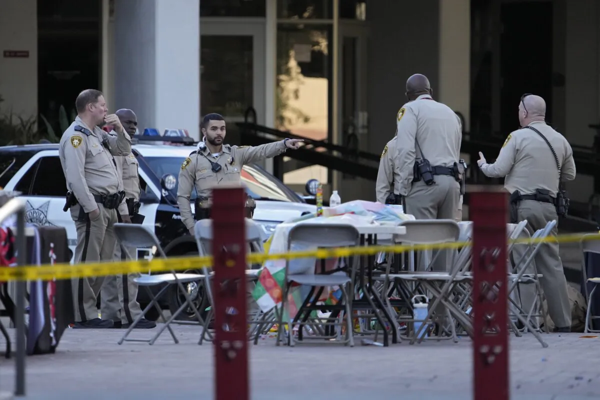 Las Vegas police stand near the scene of a shooting at the University of Nevada in Las Vegas on Dec. 7, 2023. (John Locher/AP Photo)