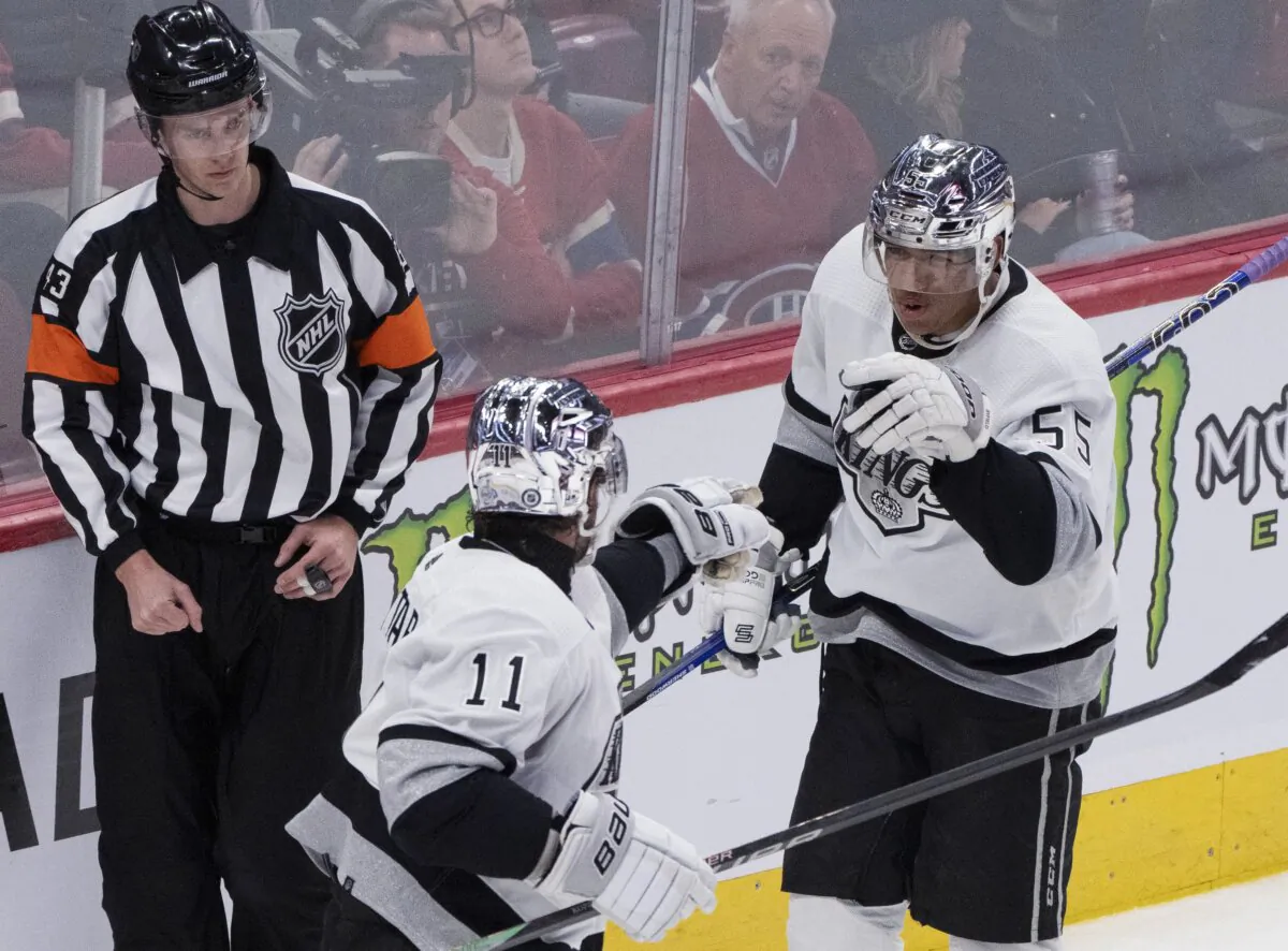 Los Angeles Kings' Quinton Byfield (55) celebrates his goal against the Montreal Canadiens with Anze Kopitar (11) during the second period of an NHL hockey game in Montreal on Dec. 7, 2023. (Christinne Muschi/The Canadian Press via AP)