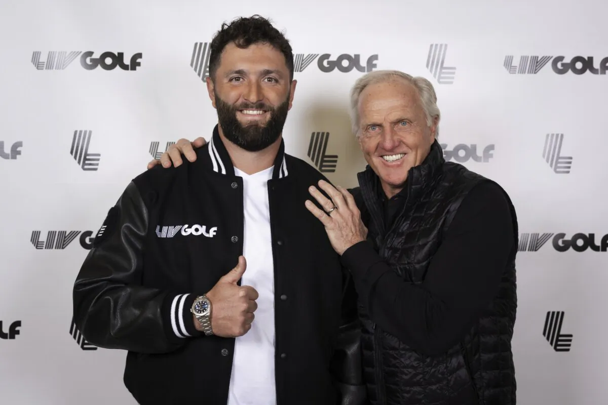Jon Rahm (L) and LIV Golf Commissioner and CEO Greg Norman pose for a photo in New York on Dec. 7, 2023. (Scott Taetsch/LIV Golf via AP)